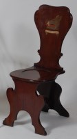 Lot 827 - An early George III mahogany hall chair, the...