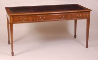 Lot 849 - A burr oak library table, having a gilt tooled...