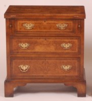 Lot 852 - A walnut and figured walnut bachelors chest,...