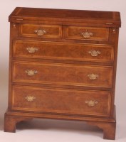 Lot 853 - A walnut and figured walnut bachelors chest,...