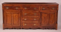 Lot 869 - An antique oak dresser base, having three...