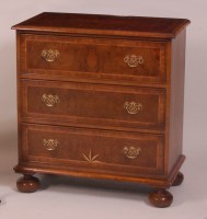 Lot 874 - A figured walnut squarefront chest, in the...