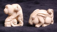 Lot 662 - A Japanese carved ivory netsuke of a monkey...