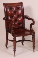 Lot 833 - A Victorian mahogany desk chair, having brown...