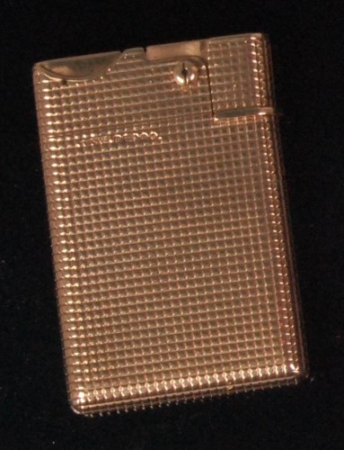 Lot 88 - An early 1970s 9ct gold pocket cigarette...