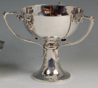 Lot 103 - An Art Nouveau silver pedestal three-handled...