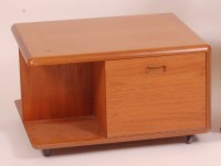 Lot 228 - A 1970s teak coffee table, having fallfront...