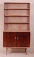 Lot 242 - A 1960s limed oak and rosewood bookcase...