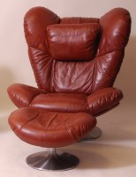 Lot 271 - A contemporary brown leather swan-type chair,...