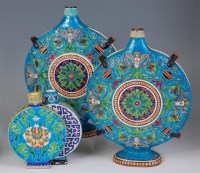Lot 733 - A pair of faience pottery moonflasks, probably...