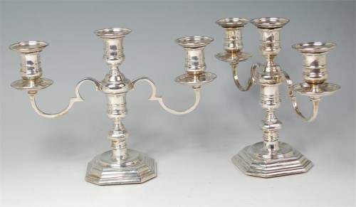 Lot 853 - A pair of silver three light candelabra, in...