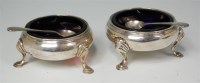 Lot 868 - Two George III silver table salts with blue...