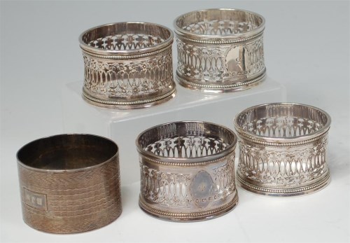 Lot 871 - A set of four Victorian silver napkin rings,...