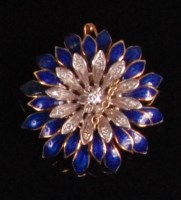 Lot 910 - An 18ct gold diamond set and blue enamel...