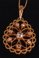 Lot 925 - A yellow metal diamond set openwork pendant,...