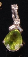 Lot 931 - A contemporary white metal green peridot and...