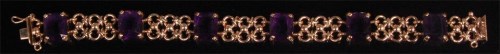 Lot 959 - A 9ct gold and amethyst bracelet, arranged as...
