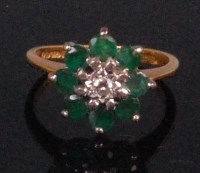Lot 965 - An 18ct gold emerald and diamond ladies dress...