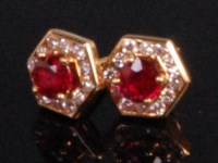 Lot 978 - A pair of contemporary 18ct yellow gold ruby...