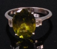 Lot 990 - A contemporary white gold green peridot and...
