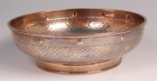 Lot 886 - A George V hammered silver footed bowl, having...