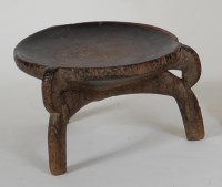 Lot 1080 - A Polynesian stool, having a dished top,...