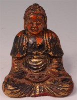 Lot 1128 - A Chinese parcel gilt bronze figure of seated...