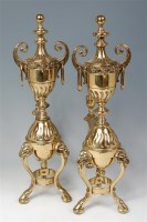 Lot 1028 - A pair of Victorian brass andirons, each as...