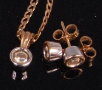 Lot 934 - A contemporary 9ct gold diamond pendant, the...
