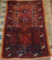 Lot 1267 - A Persian woollen prayer rug, having a...