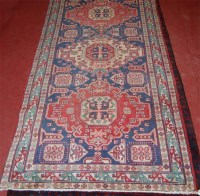 Lot 1271 - A Kurdish woollen rug, having an ornate triple...