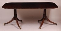 Lot 1287 - *A mahogany twin pedestal dining table, in the...