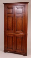 Lot 1307 - A 19th century oak freestanding corner...