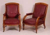 Lot 1311 - A pair of late Victorian oak library armchairs,...