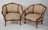 Lot 1321 - A pair of Louis XV style walnut fauteuil, with...