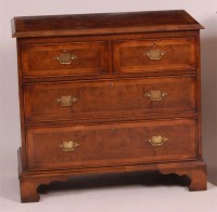 Lot 1327 - A figured walnut and crossbanded chest, in the...