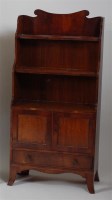 Lot 1352 - An antique mahogany waterfall bookcase, having...