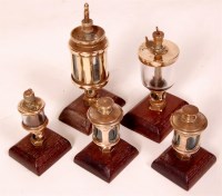 Lot 183 - A collection of 5 various brass dashpot...