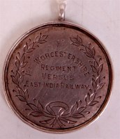 Lot 122 - A solid silver medal of Indian origin; dated...