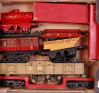 Lot 276 - A small tray of Hornby wagons including red...