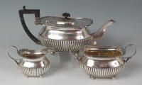 Lot 460 - A Georgian style silver three-piece teaset,...