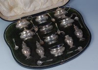 Lot 461 - A Walker & Hall cased silver twelve piece...