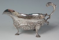 Lot 469 - A George II silver sauceboat, later repousee...