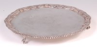Lot 472 - A George III silver salver, having a leaf and...