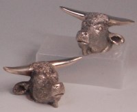 Lot 488 - A pair of silver plated knife rests modelled...