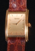 Lot 514 - A ladies 18ct gold Gucci Tank watch, having a...
