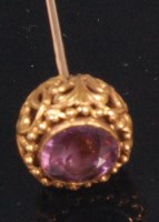 Lot 517 - A ladies 14ct gold amethyst set hat-pin, the...