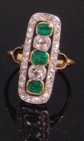 Lot 525 - An Art Deco yellow metal emerald and diamond...