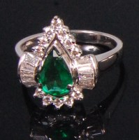 Lot 542 - A contemporary 18ct white gold emerald and...