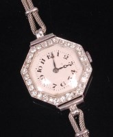 Lot 546 - A 1920s ladies white metal cased and diamond...